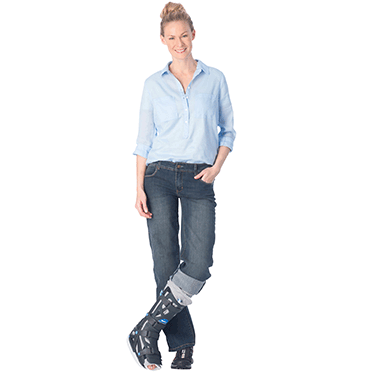 woman wearing vacocast walking boot